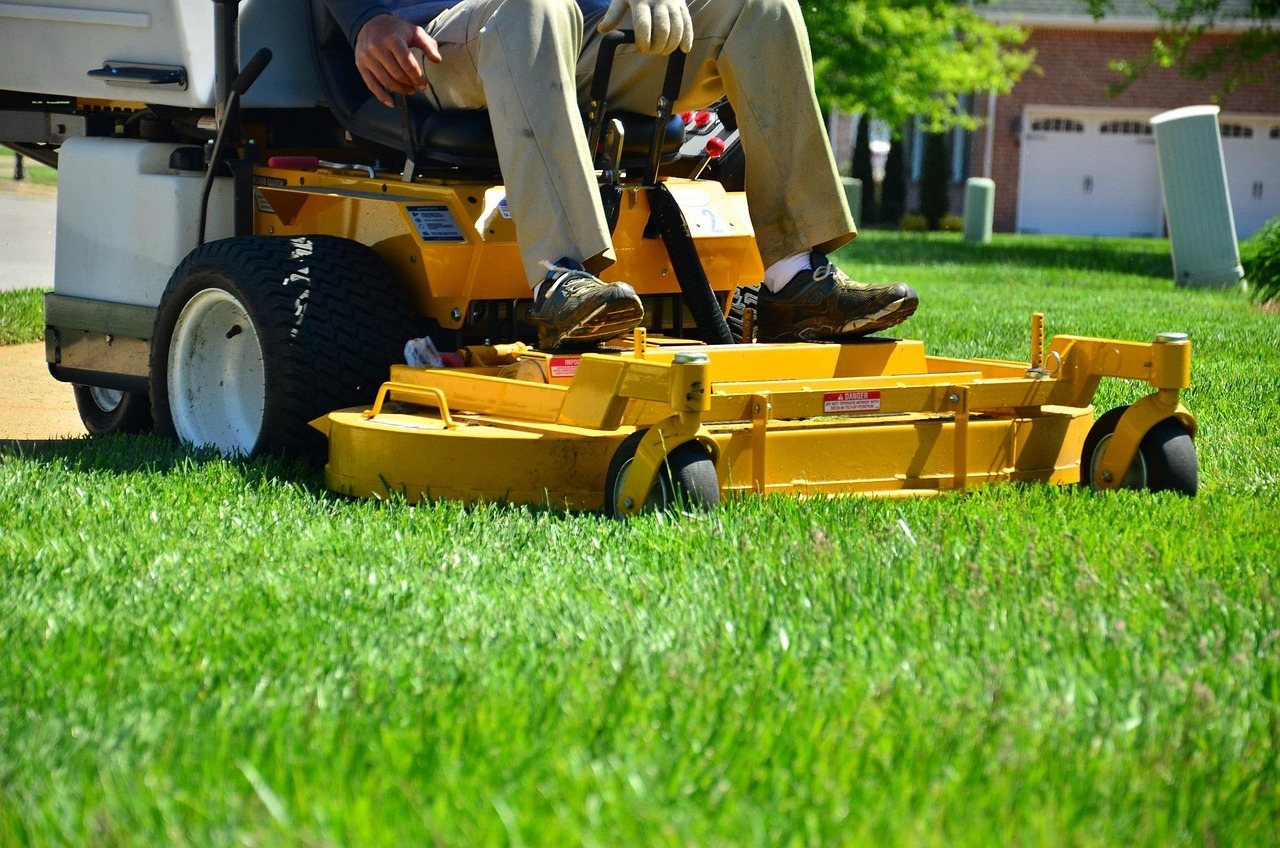 A landscaping crew mowing a lawn