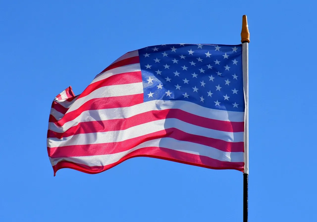 American flags against a blue sky