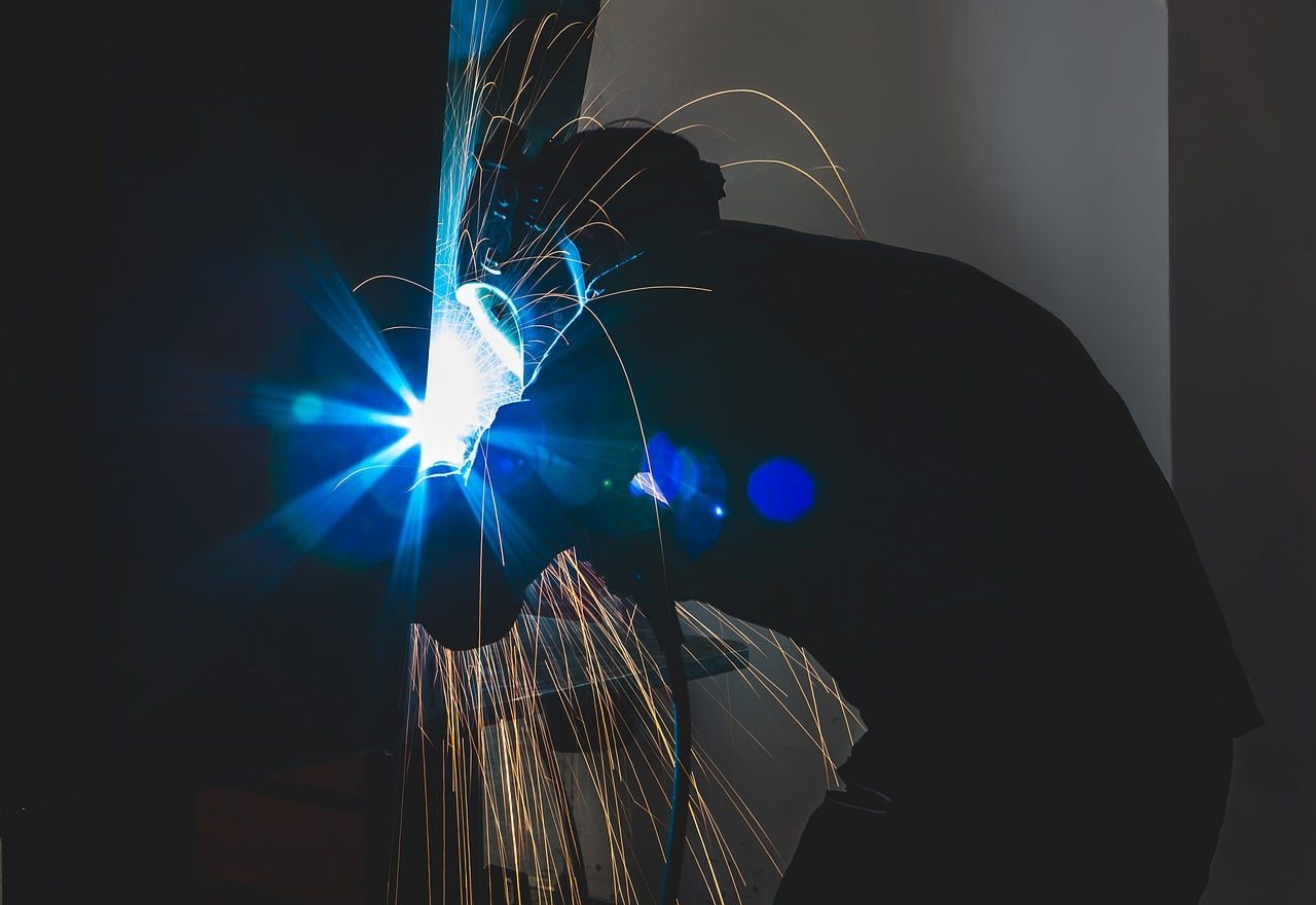 A welder at work in an industrial shop