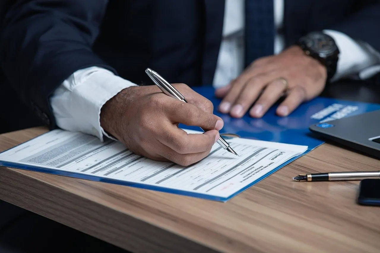 An attorney reviewing a case file at a desk
