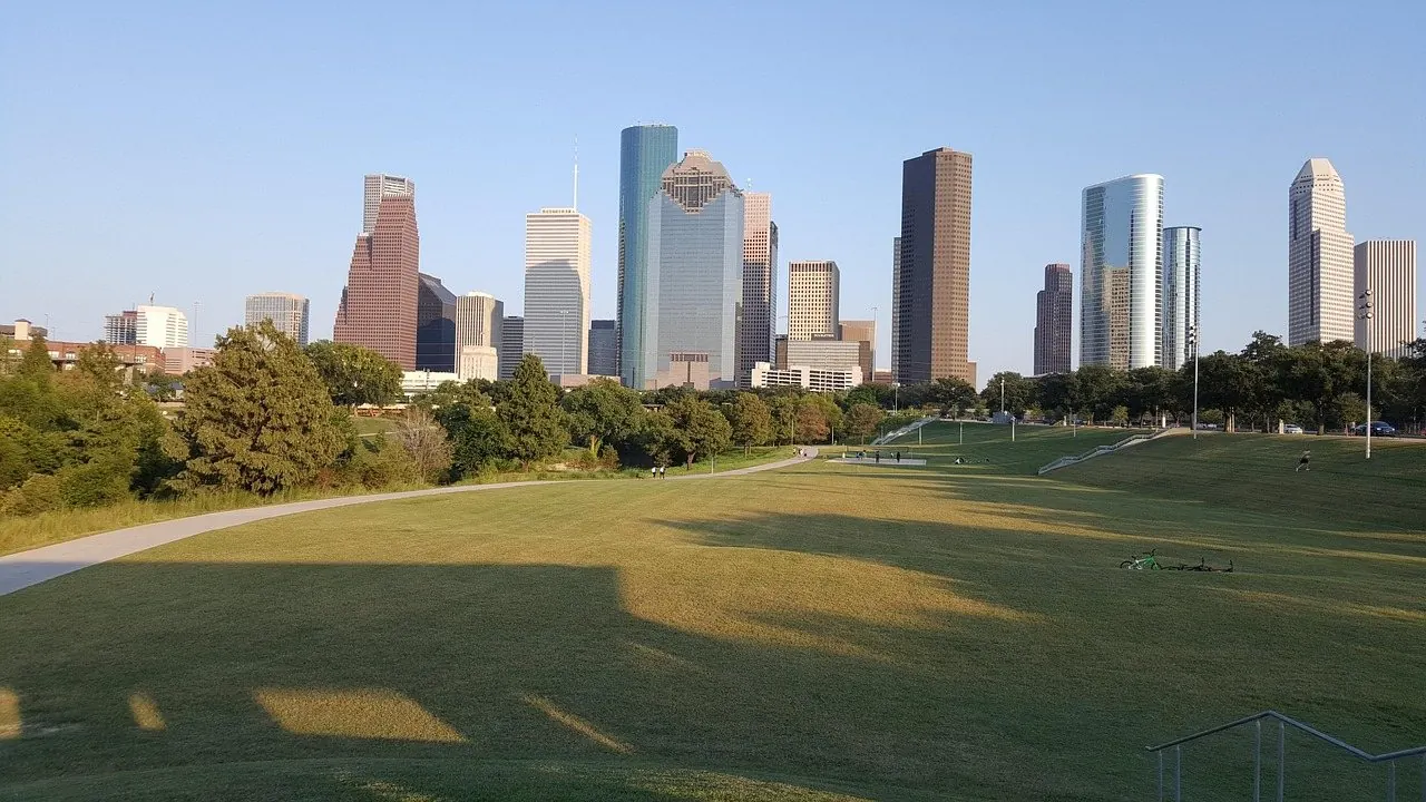 A visitor photographing the Houston skyline