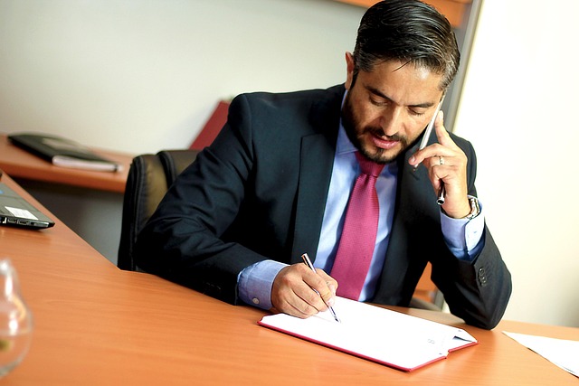 Criminal Immigration Law: How a Conviction Affects Status - attorney reviewing plea agreement papers