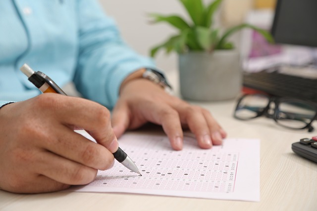 Work Authorization Form: How to File Form I-765 for an EAD - filling out government form desk pen